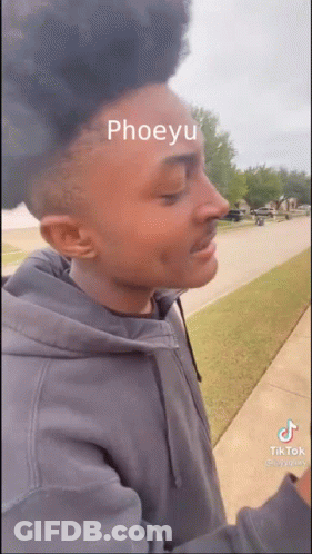 Man With Green Paint On Face And Headphones GIF