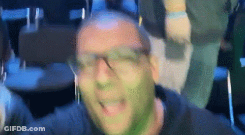 Man With Green Paint On Face Wearing Headphones GIF