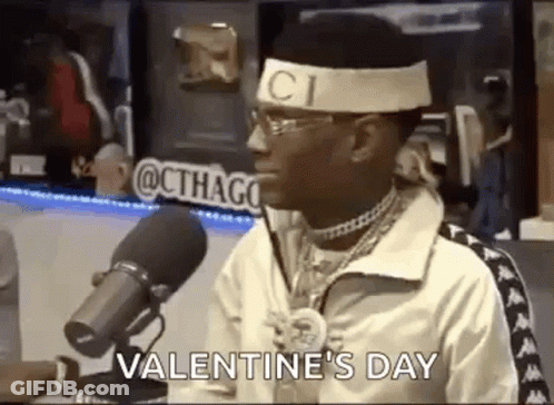 Man With Gucci Headband Sitting At Microphone Talking GIF