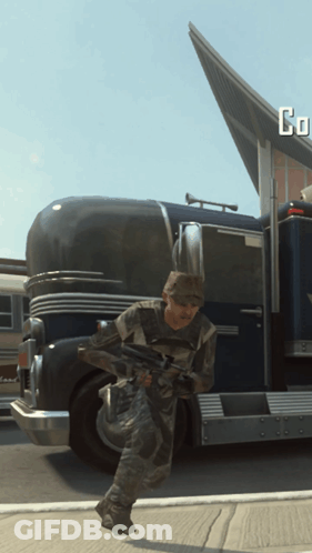 Man With Gun Running In Front Of Truck Saying Go GIF