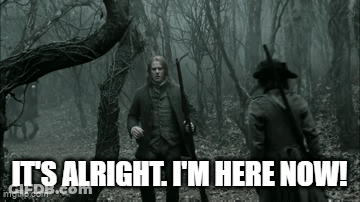 Man With Gun Standing In Woods GIF