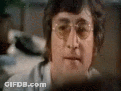 Man With Hammer On Head Looks At Camera GIF