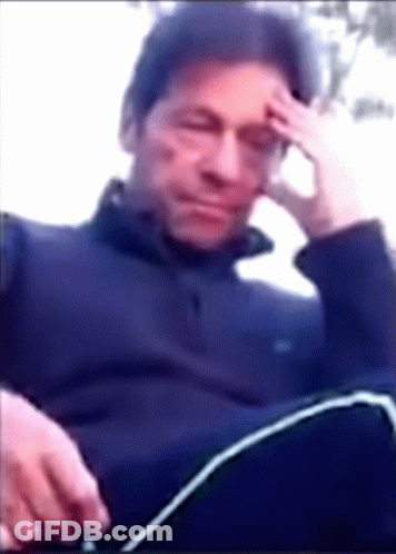 Man With Hand On Forehead Sitting Down GIF