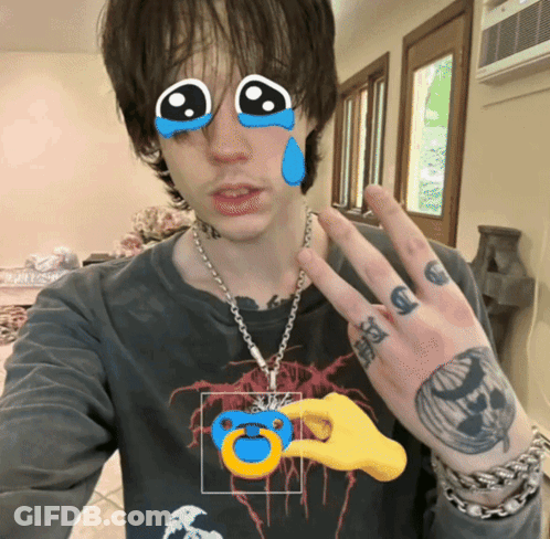Man With Hand Tattoo Holding Pacifier GIF