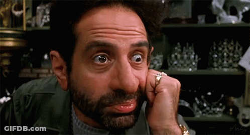 Man With Hands Behind Head In Front Of Emergency Monitor GIF