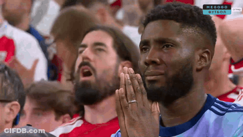 Man With Hands Folded Watching Soccer GIF