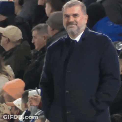 Man With Hands In Pockets In Crowd GIF