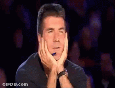 Man With Hands On Face And Pen In Mouth GIF
