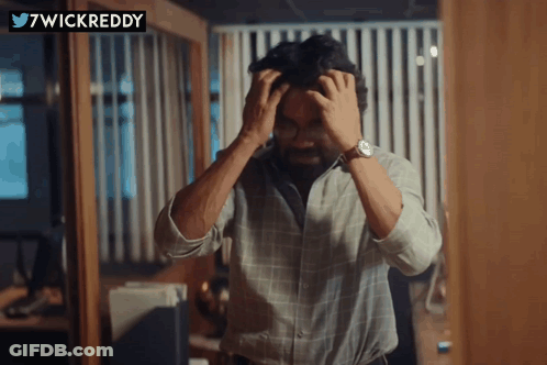 Man With Hands On Head And 7Wickreddy Logo GIF