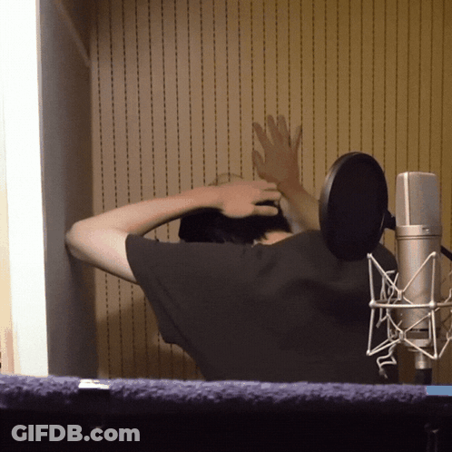 Man With Hands On Head At Microphone GIF