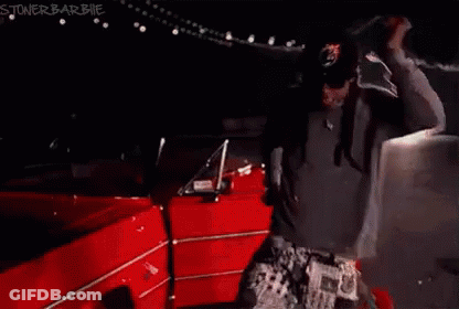 Man With Hands Up Red Car GIF