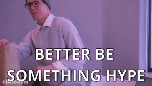 Man With Hat And Glasses Holding Brown Bag Saying Better Be Something Hype GIF