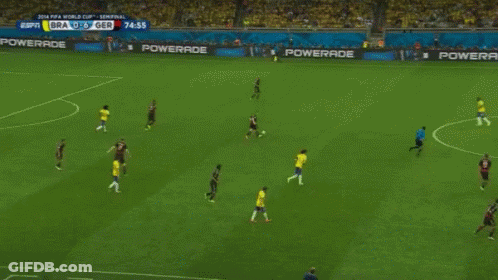 Man With Hat And Mustache Holding Soccer Trophy In Crowd GIF