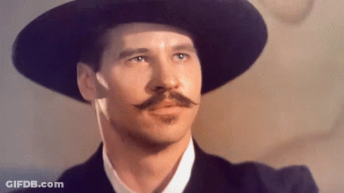 Man With Hat And Mustache Looking To Side GIF