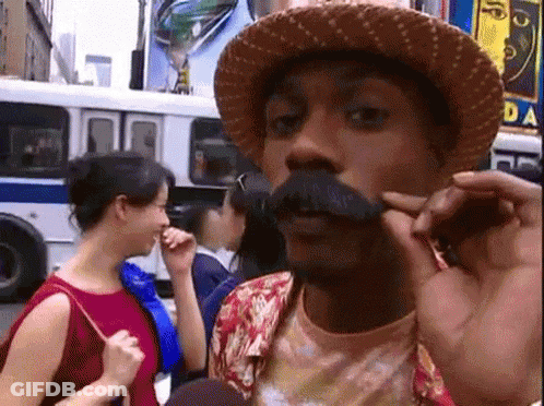 Man With Hat And Mustache Talking To Woman GIF