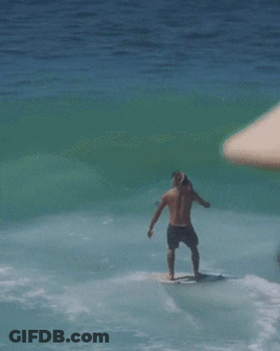 Man With Hat And Sunglasses Looking At Ocean GIF