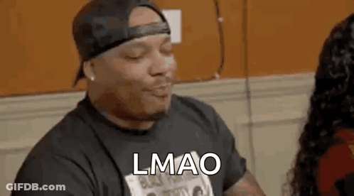 Man With Hat And T-Shirt Talking To Woman GIF