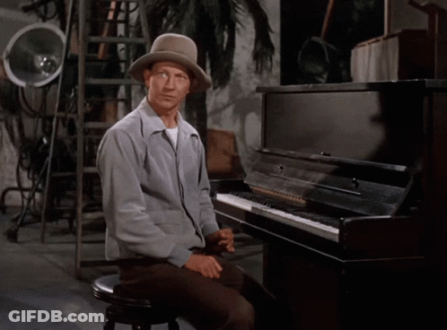 Man With Hat At Piano With No On Lap GIF