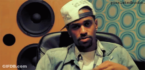 Man With Hat, Jacket, Speakers, And Pixelatedbooks GIF