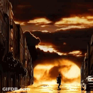 Man With Hat Letter A Standing In Front Of A Town Down GIF
