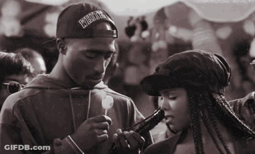 Man With Hat Saying Underground Smoking Beside Woman GIF
