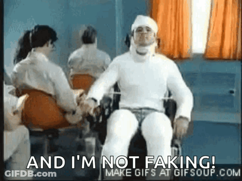 Man With Head Cast Sitting In Wheelchair Holding Hands GIF