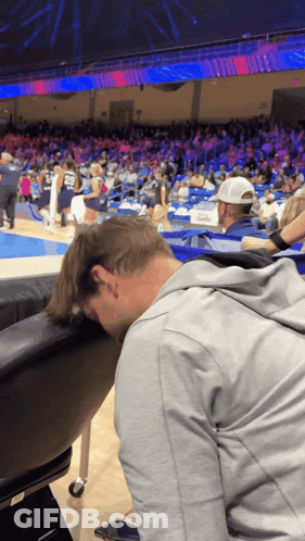 Man With Head On Chair At Basketball Game GIF