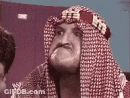 Man With Head Scarf Making Face GIF