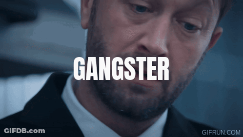 Man With Head Tattoo Looking At Another Man GIF