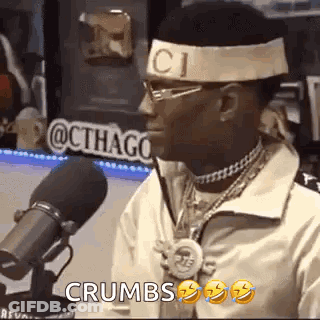 Man With Headband And Glasses At Microphone GIF