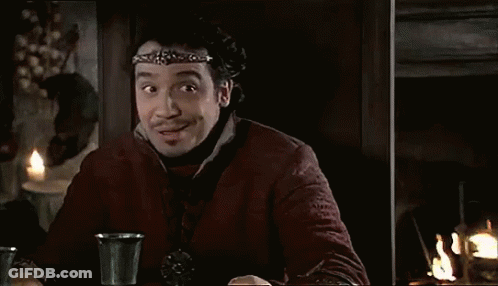 Man With Headband At Table With Two Cups GIF