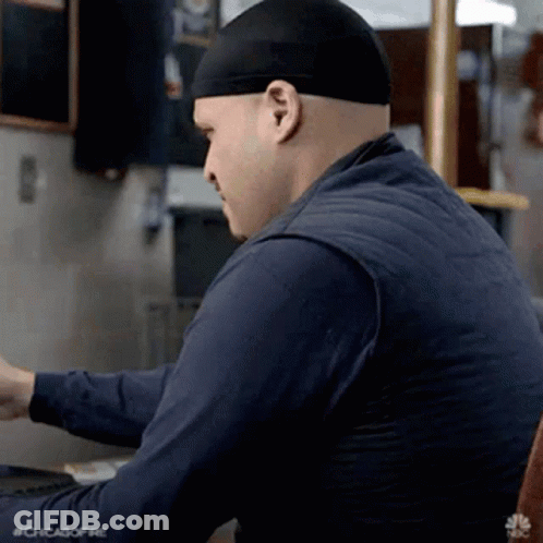Man With Headband Using Computer GIF