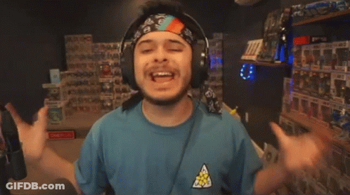 Man With Headphones And Bandana Saying A Ton GIF