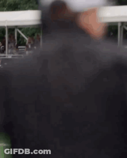 Man With Headphones And Baseball Cap On Field GIF