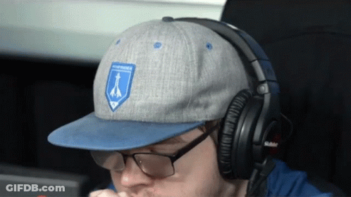 Man With Headphones And Blue Northern Patch Hat GIF