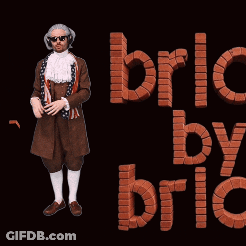 Man With Headphones And Brick By Brick Sign GIF