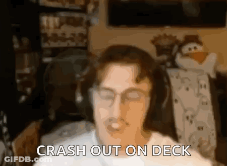 Man With Headphones And Crash Out On Deck GIF