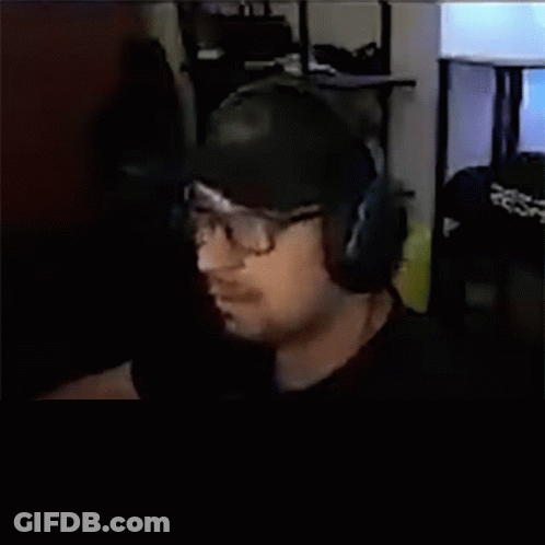 Man With Headphones And Glasses Asking What Is This Guy Doing GIF
