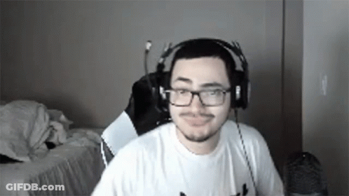 Man With Headphones And Glasses At Computer GIF