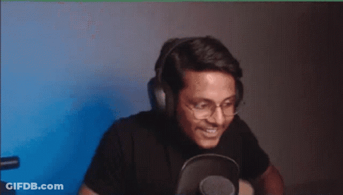 Man With Headphones And Glasses Eating At Microphone GIF