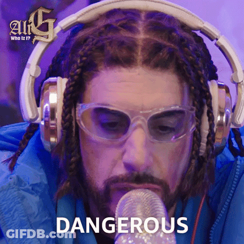 Man With Headphones And Glasses Holding Microphone Says Dangerous GIF