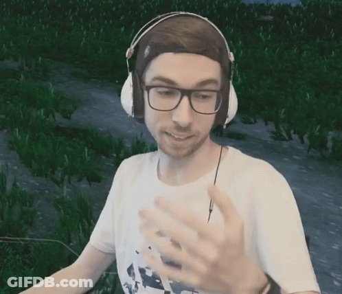 Man With Headphones And Glasses In Green Field GIF