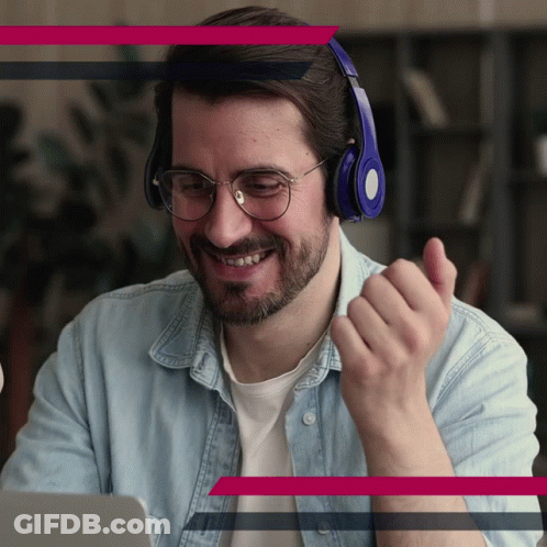Man With Headphones And Glasses Smiling At Laptop GIF