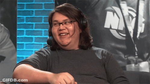 Man With Headphones And Glasses Smiling In Front Of NYC Sign GIF