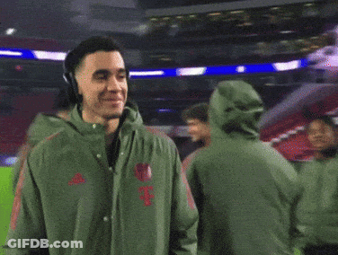 Man With Headphones And Green Jacket Smiling GIF