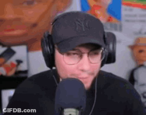 Man With Headphones And Hat At Microphone GIF