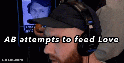 Man With Headphones And Hat Feeding Love GIF