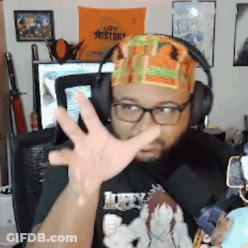 Man With Headphones And Headband Gesturing In Front Of Can History Sign GIF