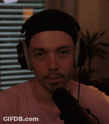Man With Headphones And Headband Speaking Into Microphone GIF