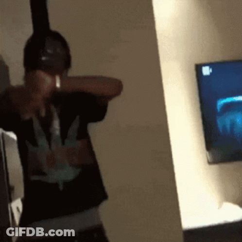 Man With Headphones And Marijuana Shirt At TV GIF